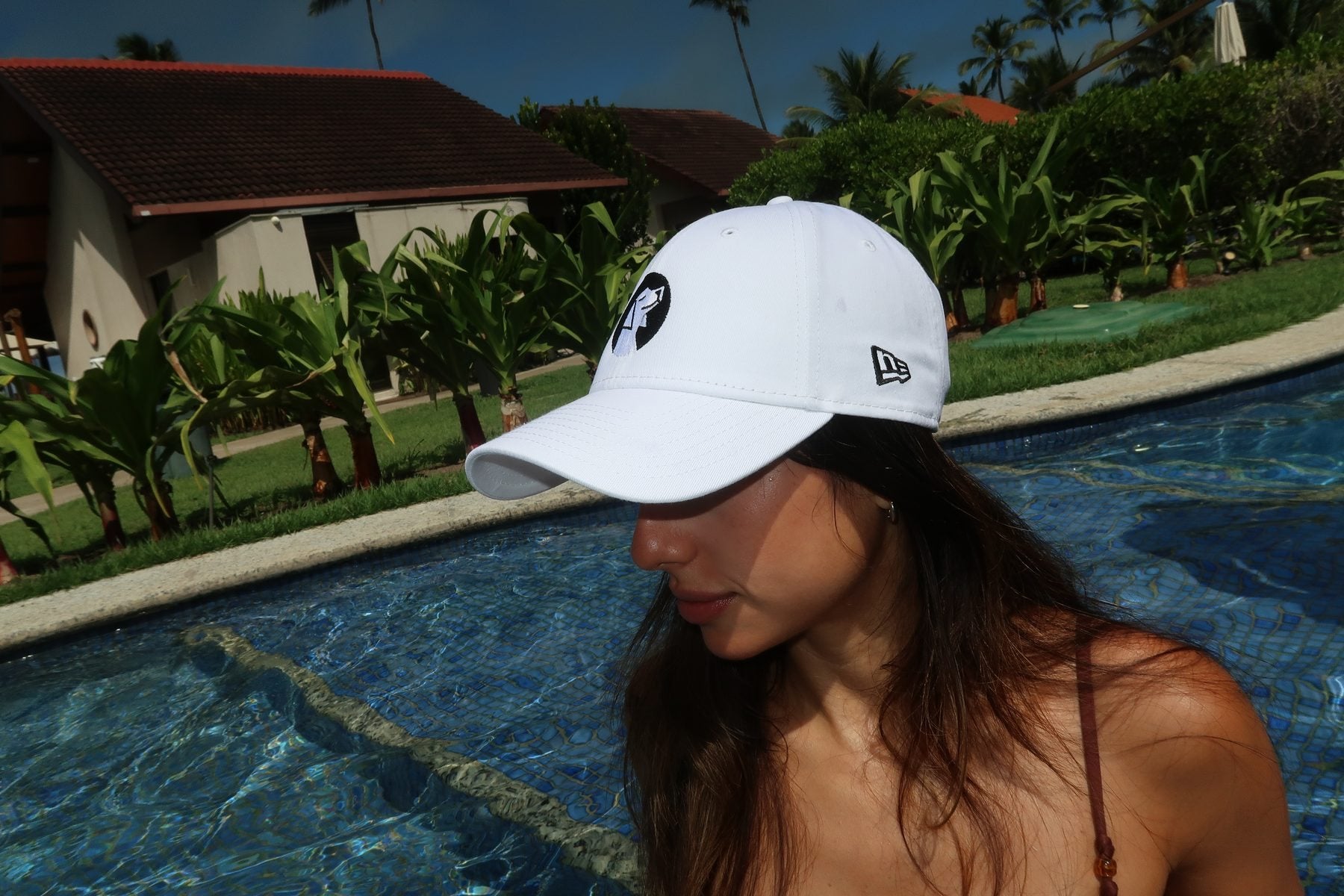 Good Dog cap in white, worn poolside