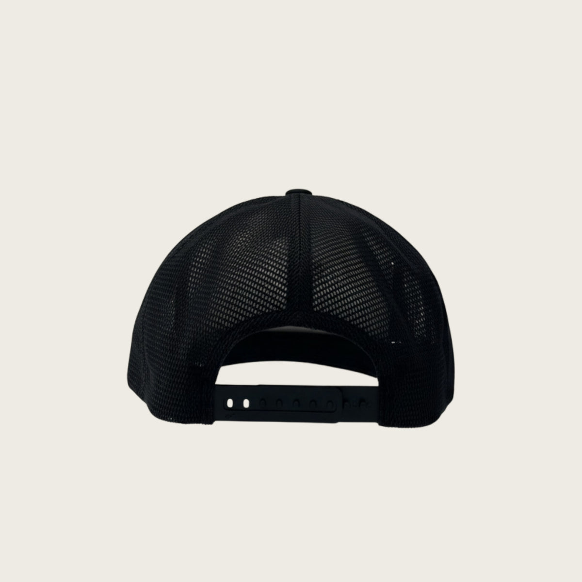 Bad Dog mesh-back trucker cap in black, back view with snapback closure