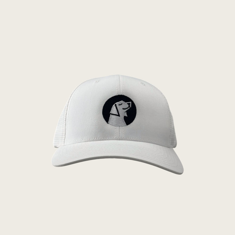 Good Dog mesh-back trucker cap in white, front view, embroidered dog mark