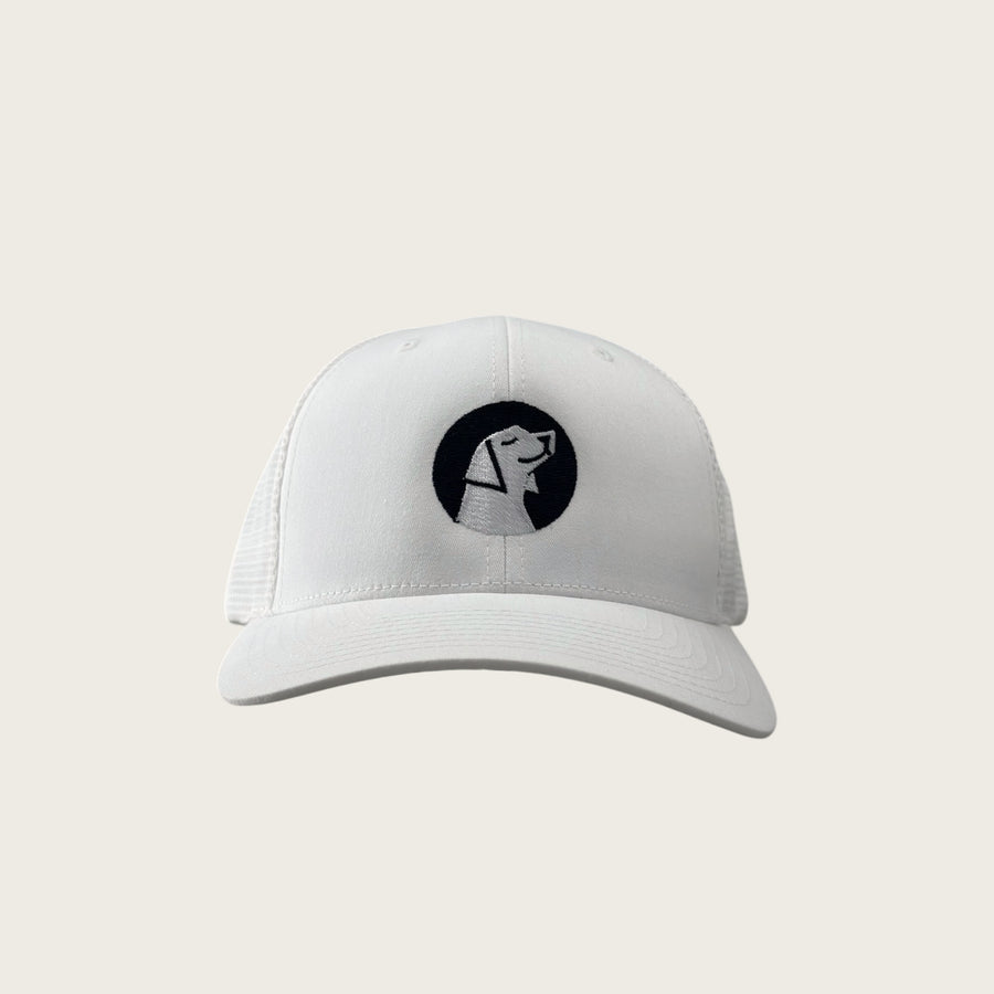 Good Dog mesh-back trucker cap in white, front view, embroidered dog mark